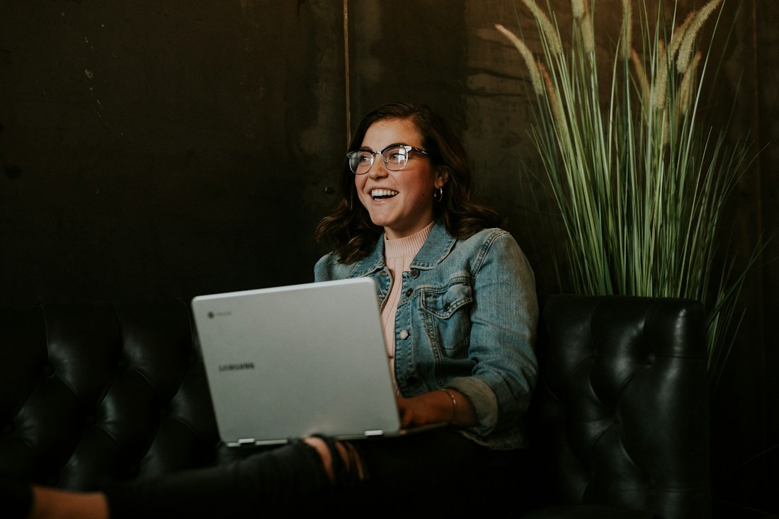 A customer-focused team member working on a laptop